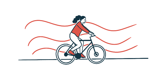 A person in a red shirt rides a bicycle in front of a background of wavy red stripes.